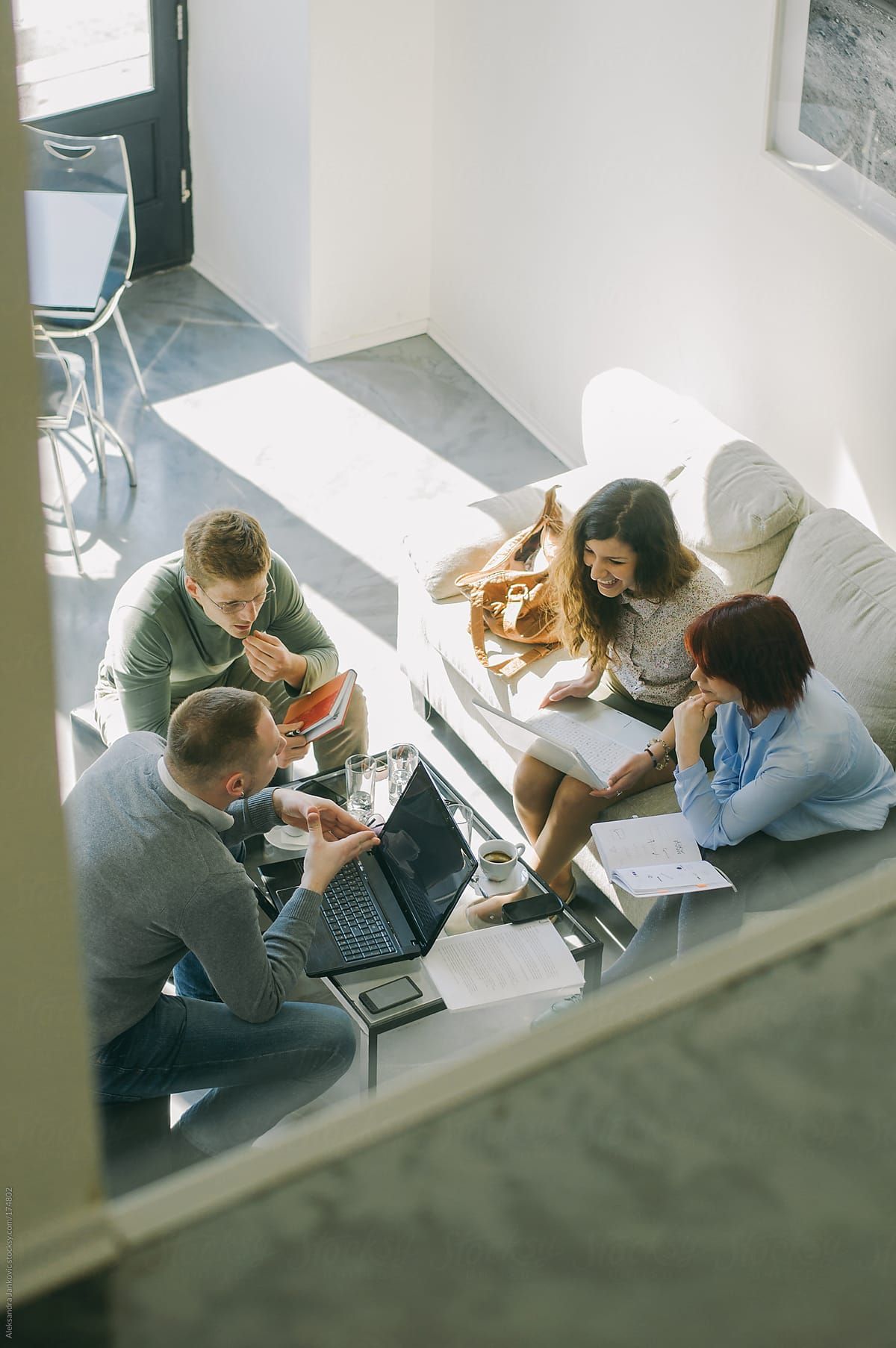 People collaborating in a relaxed learning session